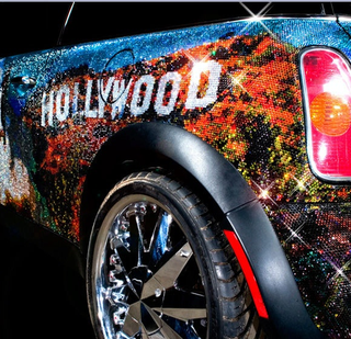 Illustration for article titled Mini Cooper Covered In One Million Swarovski Crystals... Is Proud To Be An American?